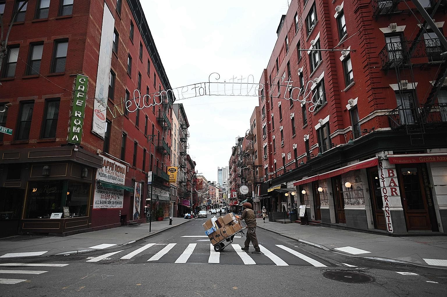 Closed shops and restaurants seen in Manhattan's Little Italy last week in New York City. The coronavirus outbreak has transformed the United States virtually overnight from a place of boundless consumerism to one suddenly constrained by nesting and 