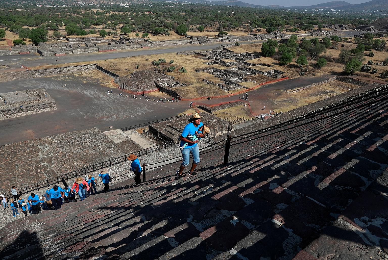 People climbing the Pyramid of the Sun to welcome the spring equinox in the pre-Hispanic city of Teotihuacan, on the outskirts of Mexico City, last Friday. It is a time of renewal in the natural world and, for agricultural communities, it is often th