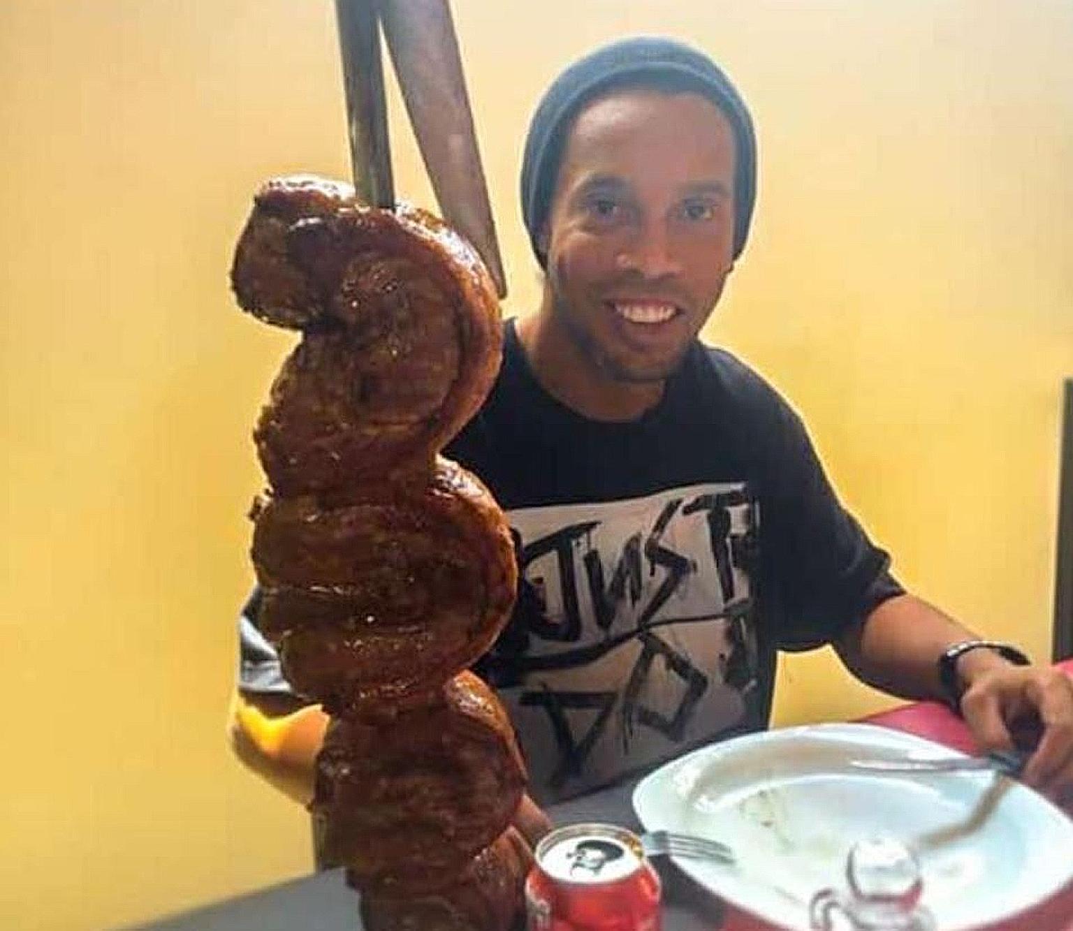Ronaldinho enjoying a barbecue birthday dinner on Saturday in the Paraguayan prison he is locked up in for using a fake passport. The Brazilian World Cup-winner turned 40 in jail after his request to be transferred to house arrest in Brazil was turne