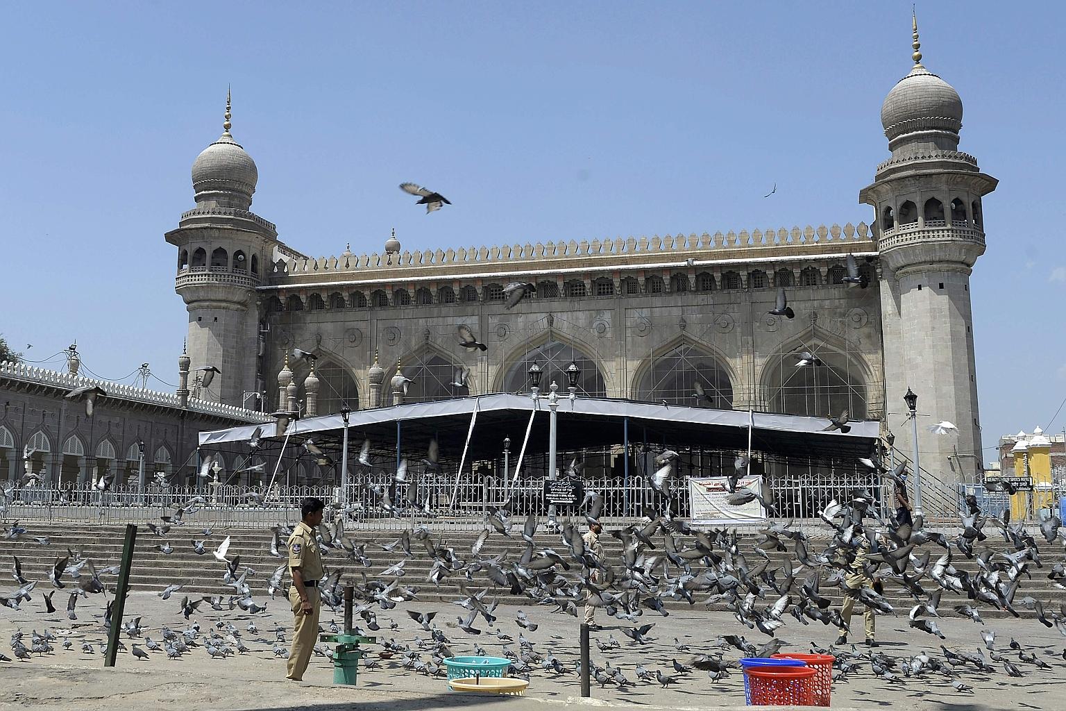 A policeman keeping watch outside Mecca Masjid in Hyderabad yesterday during a 14-hour nationwide curfew imposed to curb the spread of the coronavirus. PHOTO: AGENCE FRANCE-PRESSE