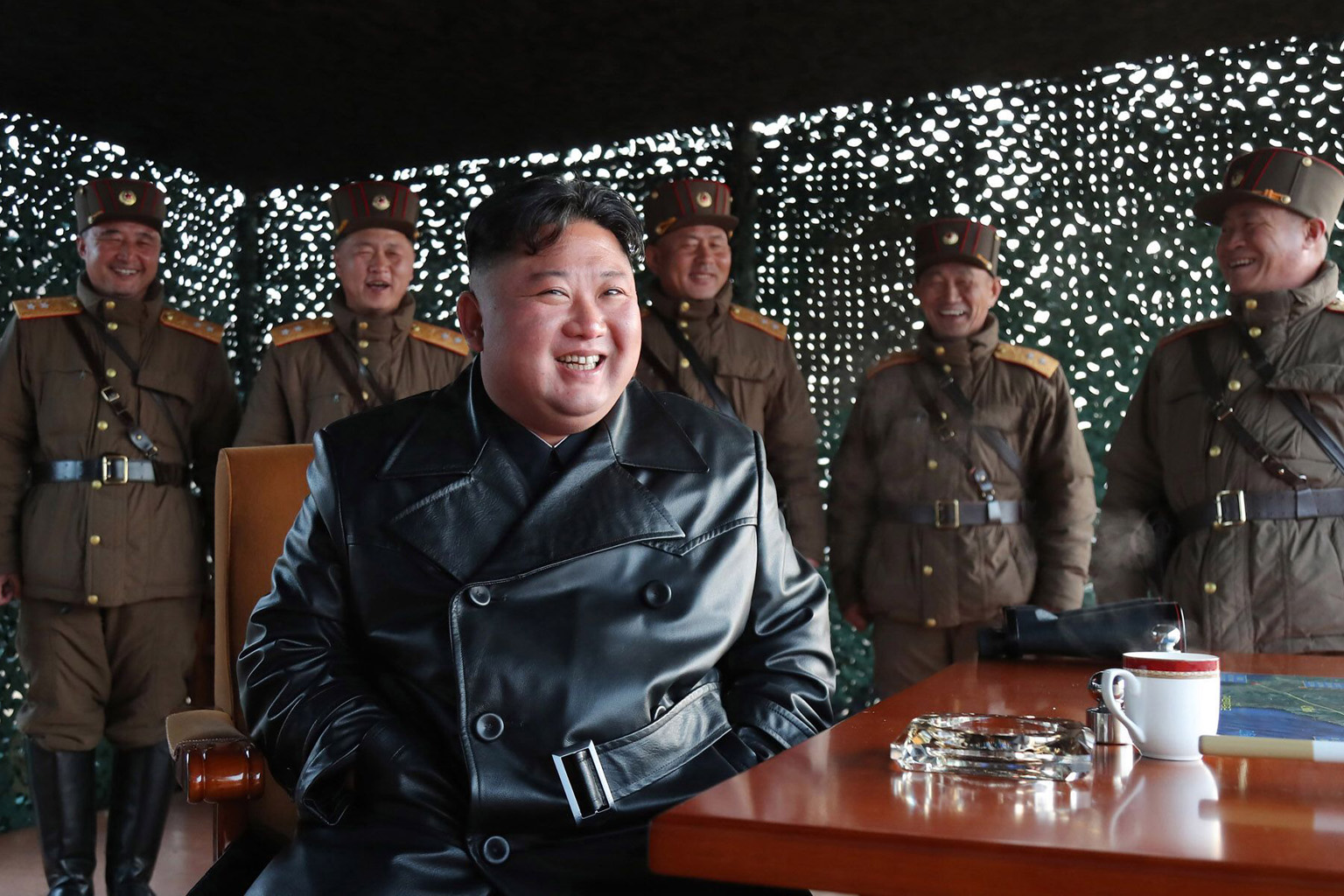 North Korean leader Kim Jong Un observing a demonstration firing of tactical guided weapons in North Korea last Saturday. PHOTO: AGENCE FRANCE-PRESSE