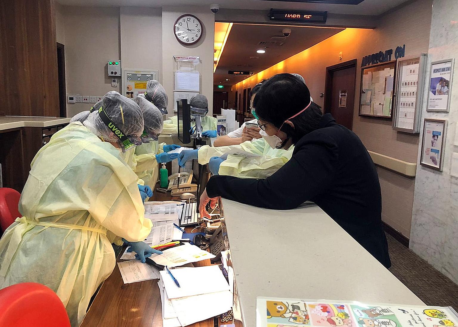 Mount Elizabeth Hospital ward nurses preparing to receive the Covid-19 patients before their arrival. The transferred patients were ones who were no longer sick, or needed less medical care, but were still shedding the virus. PHOTO: MOUNT ELIZABETH H