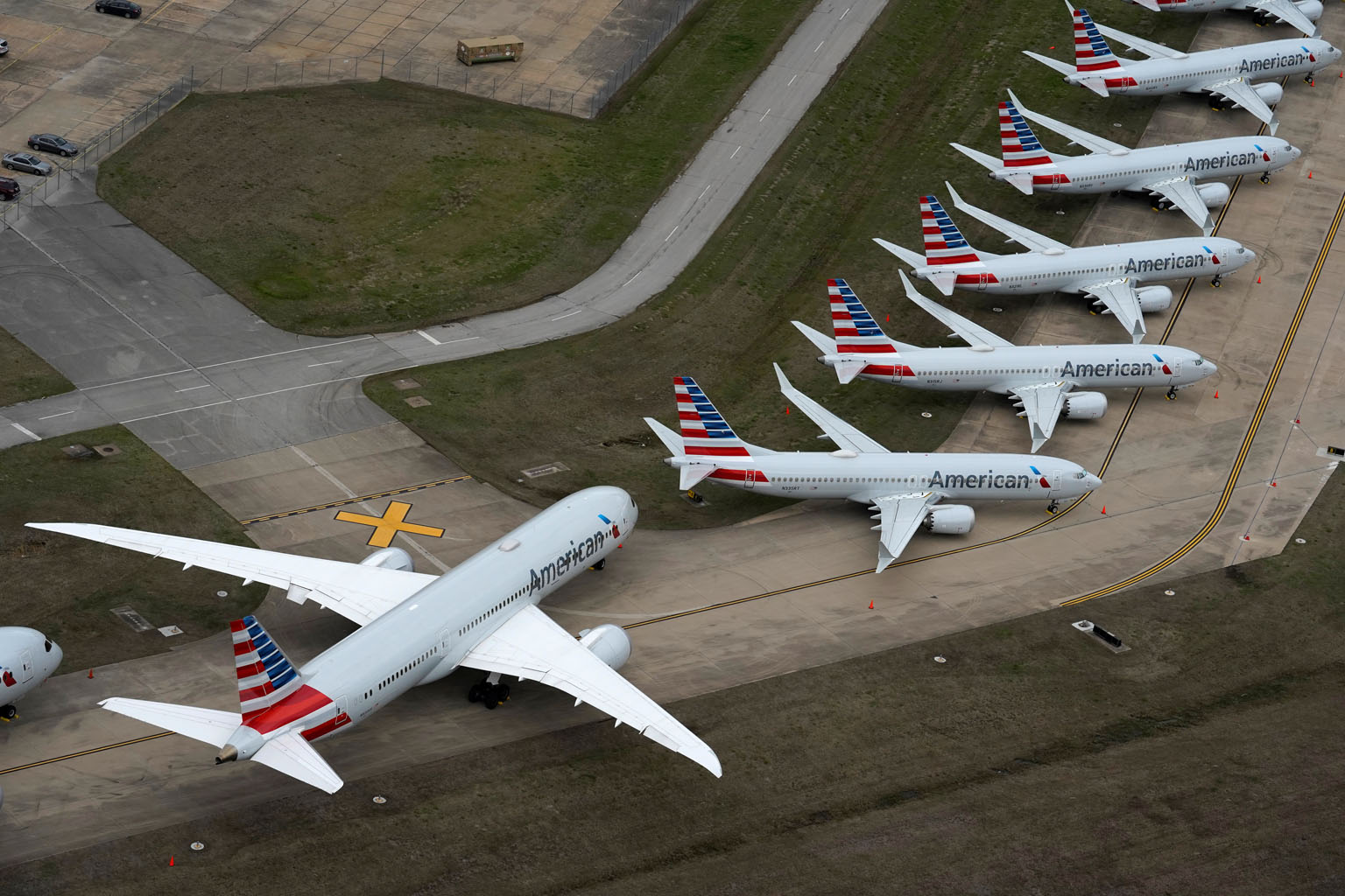 American Airlines passenger planes crowding a runway at Tulsa International Airport in Oklahoma in the United States this week. Amid flight reductions in an attempt to slow the spread of the coronavirus, taxiways, maintenance hangars and even runways