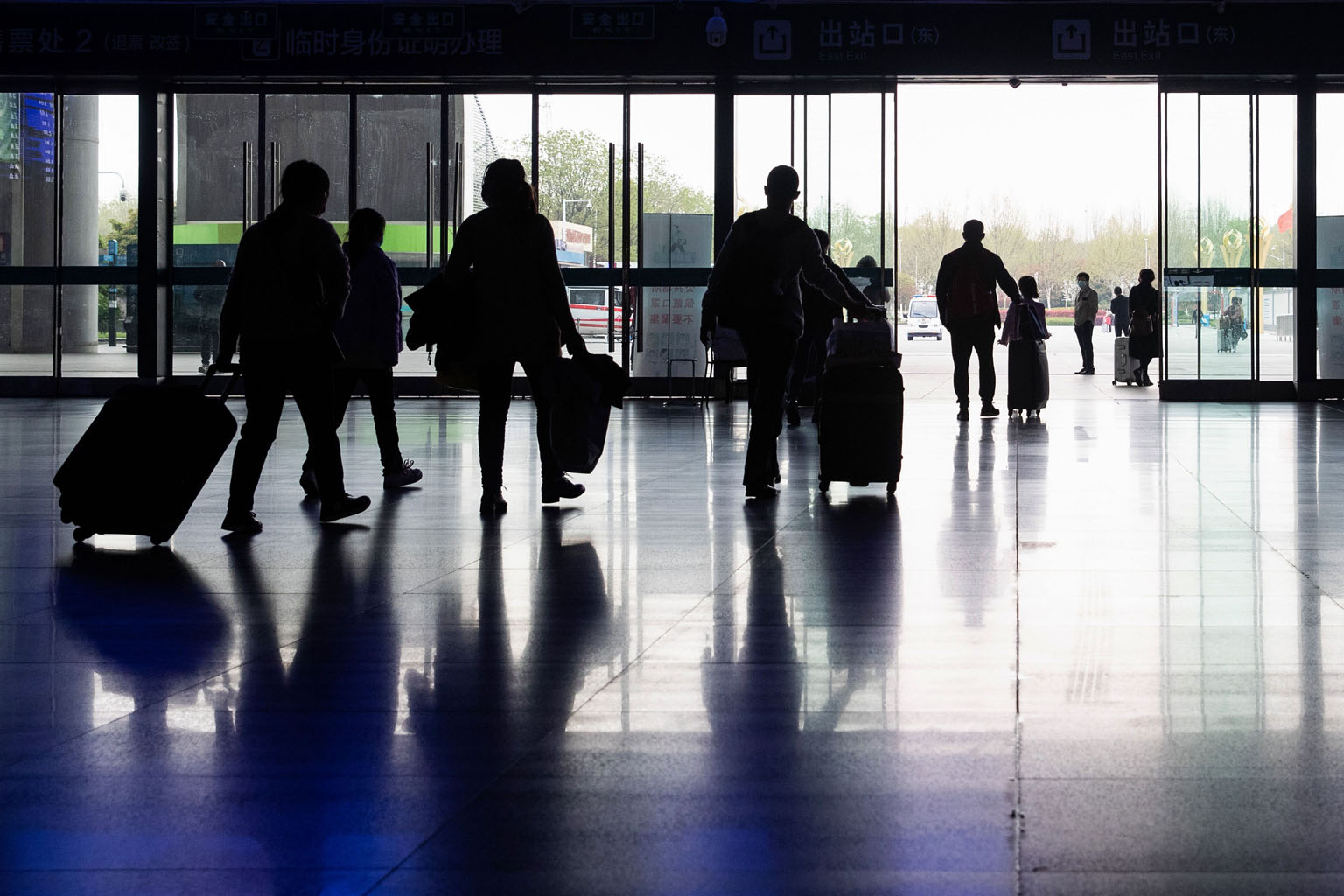 Passengers at a railway station in Wuhan on Tuesday, after China announced that a lockdown would be lifted on more than 50 million people in Hubei province. As the rest of the world continues to battle the coronavirus pandemic, some semblance of norm