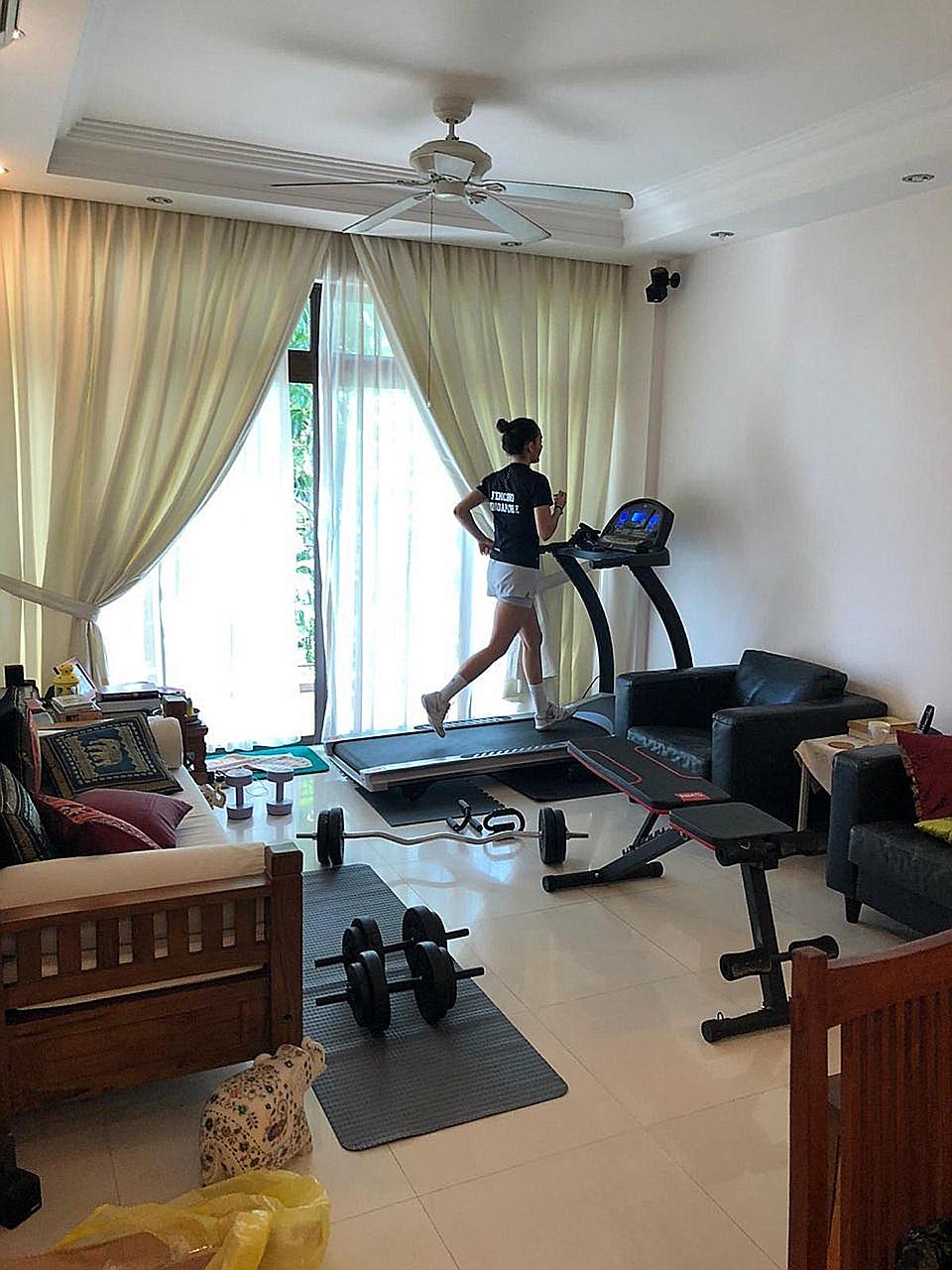 Amita Berthier using the treadmill to keep her fitness level up while serving a stay-home notice since Wednesday. PHOTO COURTESY OF AMITA BERTHIER
