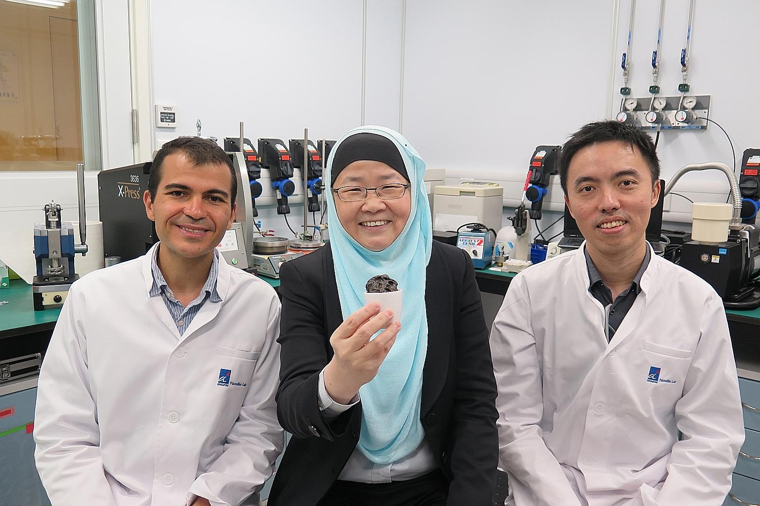 (From left) Dr Ayman AbdelHamid, Professor Jackie Y. Ying and Mr Jian Liang Cheong, the A*Star NanoBio Lab researchers who have designed a quasi-solid electrolyte for lithium batteries. Prof Ying is holding the electrolyte, made using a process that 
