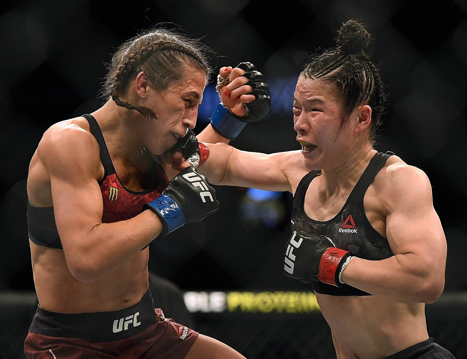 Zhang Weili punching Joanna Jedrzejczyk on her way to a split-decision win earlier this month in Las Vegas, Nevada.