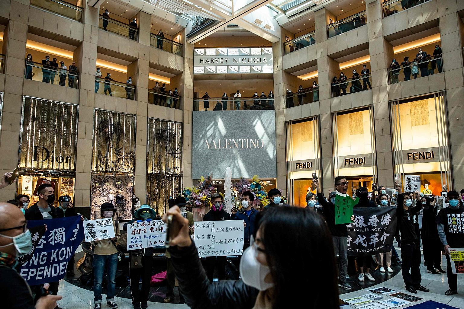 Protesters gathering in a shopping mall in Hong Kong last month. Crowds on the streets have dropped from many thousands to a few hundred as Hong Kongers adopt social distancing to fight the coronavirus. PHOTO: AGENCE FRANCE-PRESSE