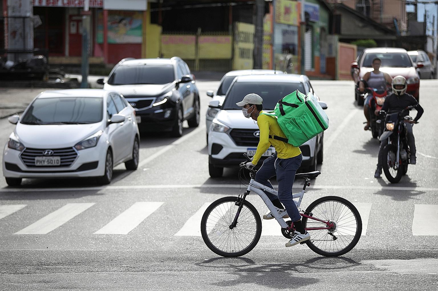 Food delivery has become popular in Brazil amid the pandemic as people stay in. The writer recounts his experience of having to key in his password with his bare fingers into a payment machine countless others had touched.