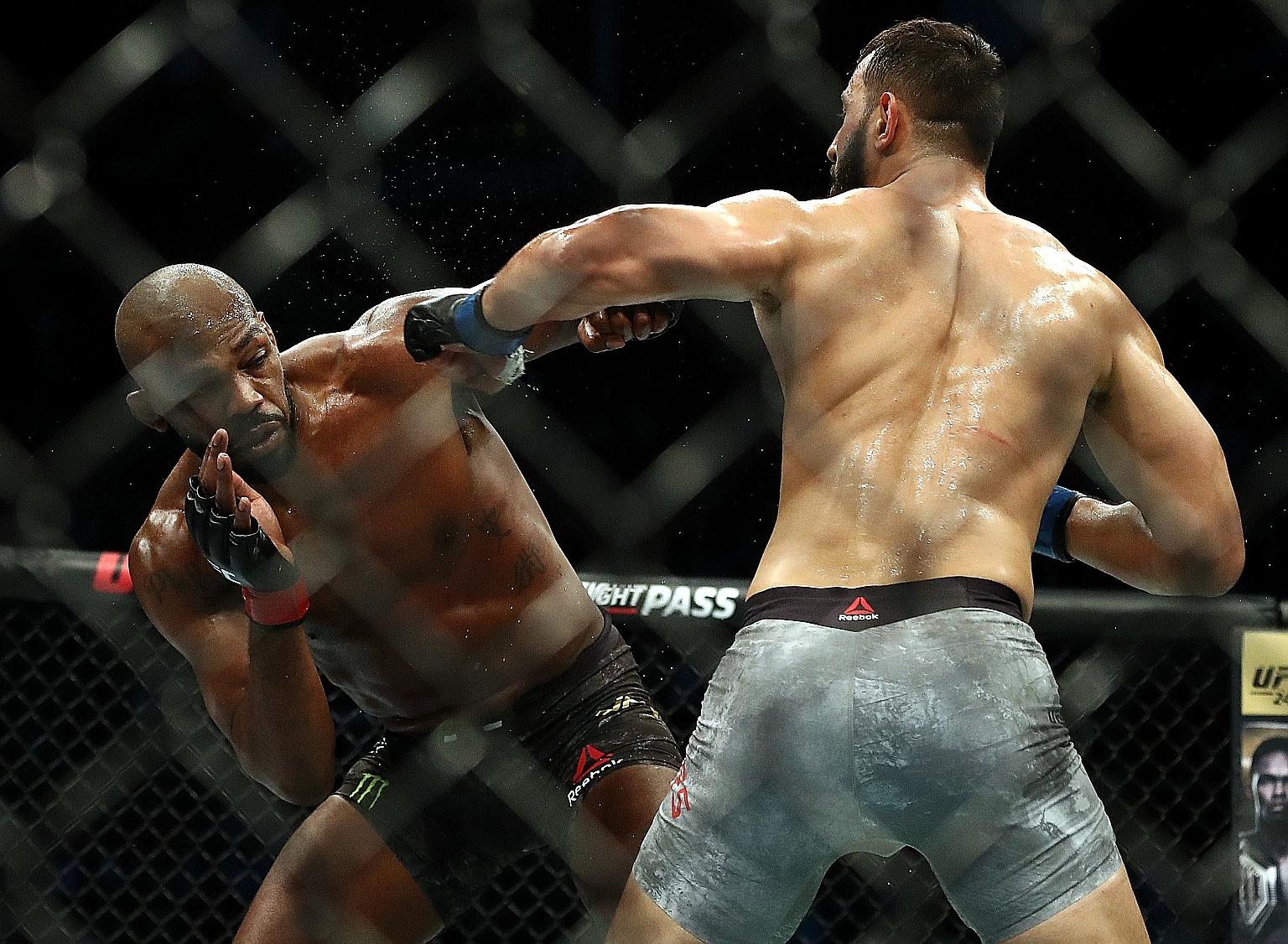 Jon Jones (left) dodging Dominick Reyes' punch during their UFC 247 light heavyweight bout in Houston last month.