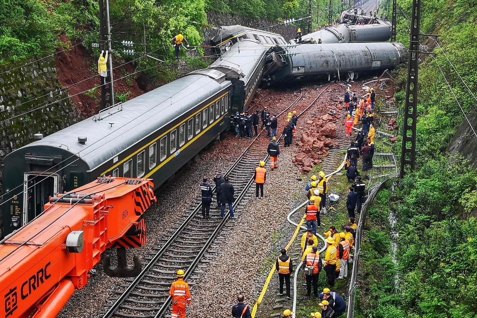 A passenger train derailed after striking debris from a landslide in central China yesterday. One person was killed and 127 others injured. The accident happened around midday in a rural part of Hunan province and came after recent heavy rain trigger