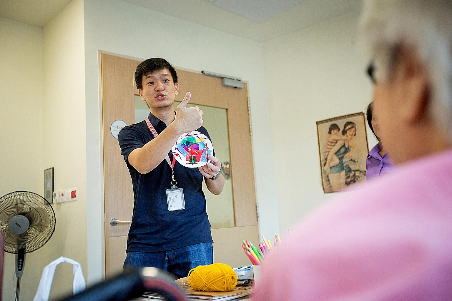 Art therapist Lee Sze-Chin during a session at Jurong Community Hospital. Instead of holding sessions on different premises, he now conducts his art therapy sessions at just one organisation - St Luke's Hospital - and does some of these sessions thro