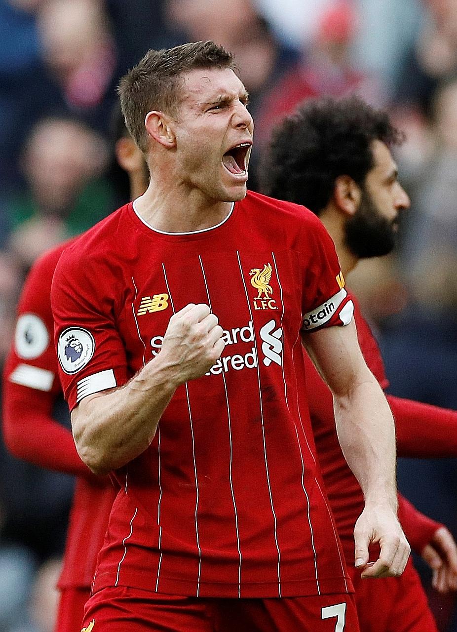 Liverpool's James Milner celebrating after a 2-1 win over Bournemouth on March 7, their last match before the Premier League season was suspended until April 30 owing to the coronavirus pandemic. The Reds top the table on 82 points and need only two 