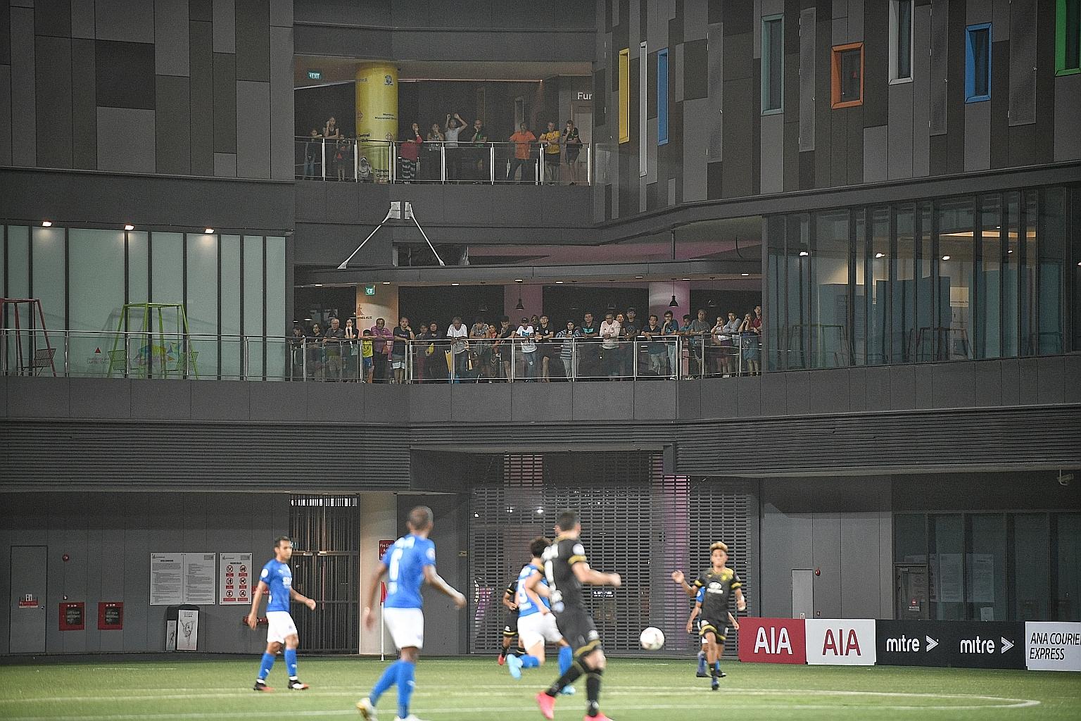 Fans watching the action from the sidelines as Tampines Rovers and Lion City Sailors play their Singapore Premier League match at Our Tampines Hub behind closed doors on March 18. The league was suspended last Tuesday.