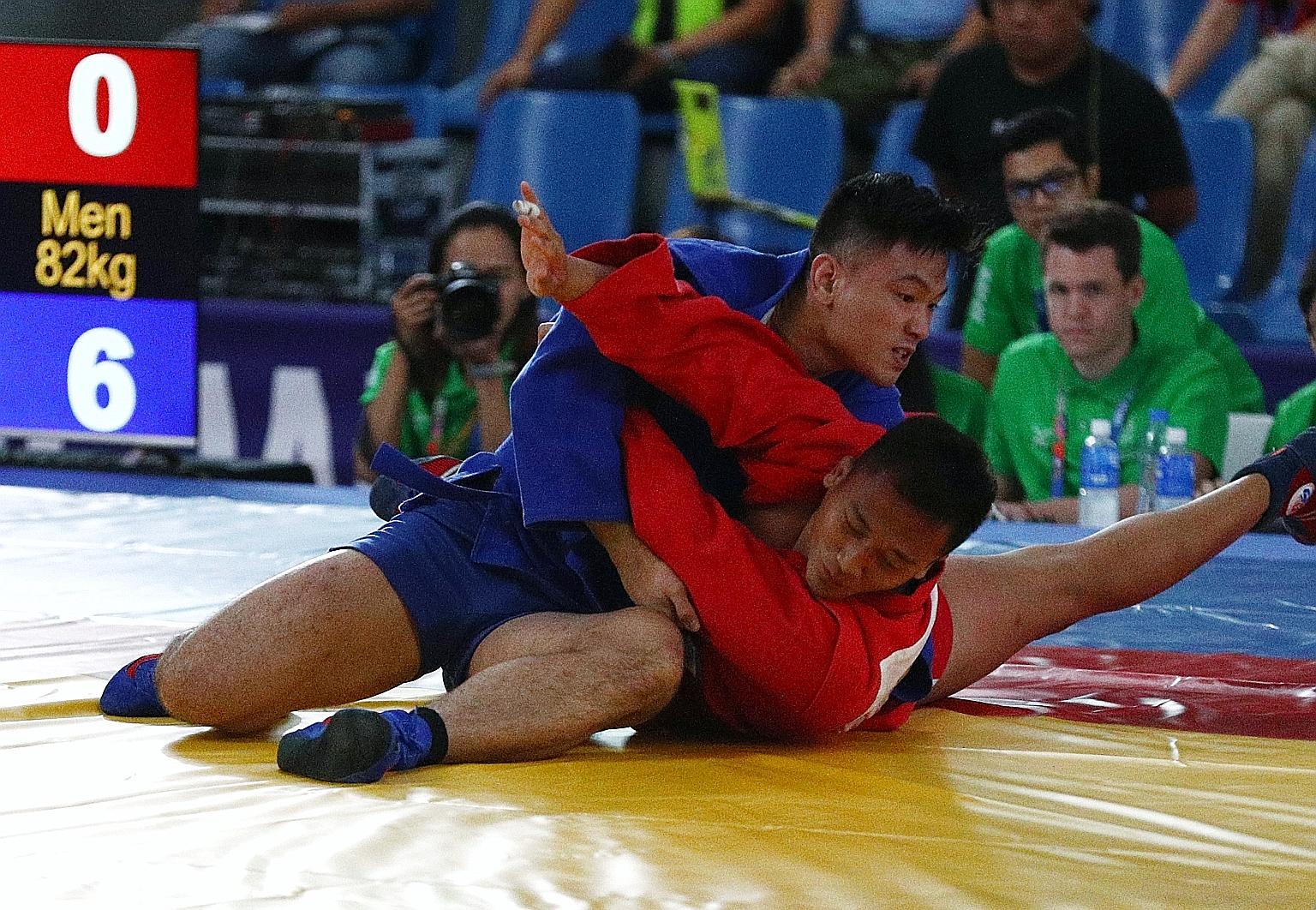 Gary Chow competing at last year's SEA Games in the sambo 82kg event. The Singaporean, who won silver in the Philippines, had pulled out of the judo squad for the Games. LIANHE ZAOBAO FILE PHOTO