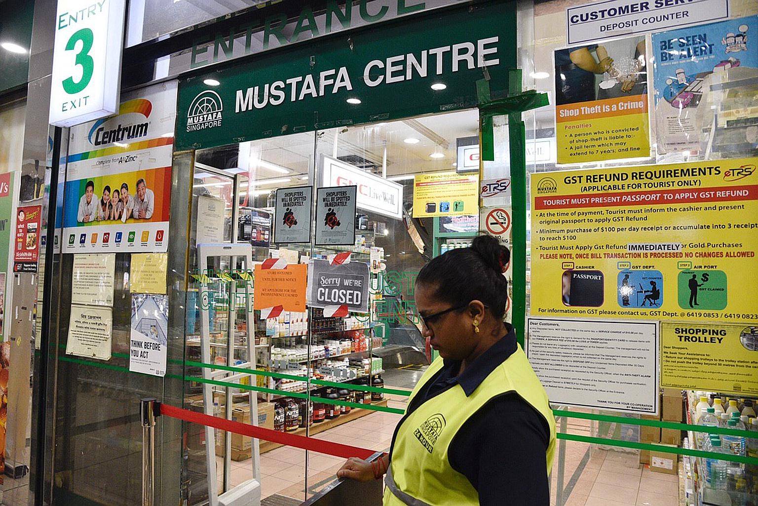 A sign put up late last night at the 24-hour Mustafa Centre, announcing that it would be closed until further notice. A total of 11 cases - including those announced earlier - have been linked to the cluster.