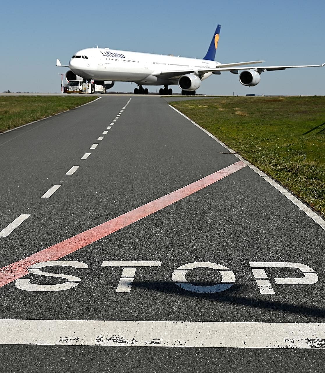 German airline Lufthansa has grounded 95 per cent of its fleet because of the coronavirus pandemic. The airline said on Thursday it would cancel all flights except those to return stranded tourists, until May 3. PHOTO: REUTERS