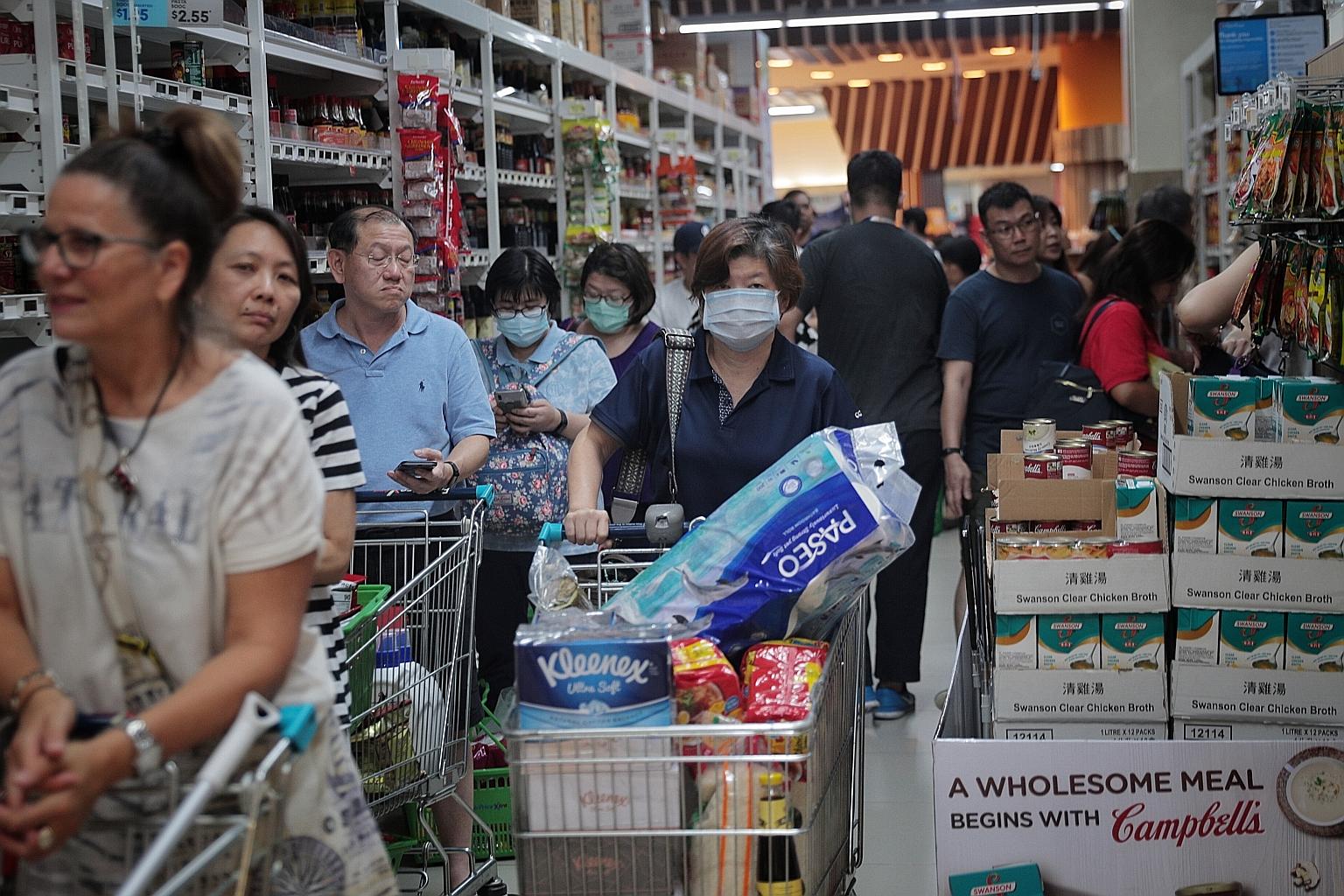 Shoppers at the FairPrice outlet in Jem. Trade and Industry Minister Chan Chun Sing reiterated reassurances that the country has enough supplies to meet its needs, but stressed that Singaporeans had a part to play. "No amount of stockpile will ever b
