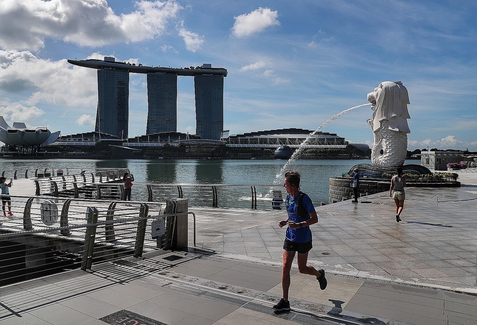 An almost empty Merlion Park yesterday. While necessary to contain the spread of the coronavirus, Singapore's circuit breaker measures through this month alone will impede economic growth in the second quarter and pull the economy into a deeper reces