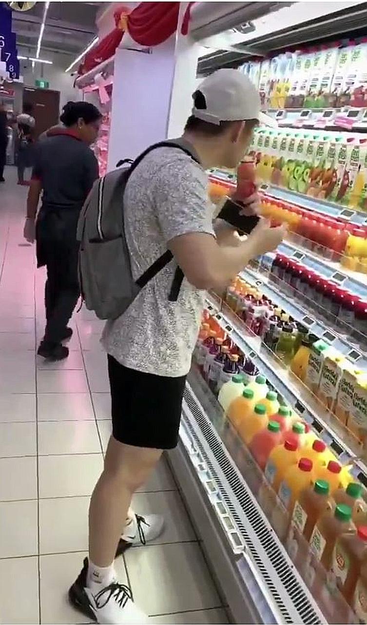 In the video, a boy is seen drinking from a bottle of juice in a FairPrice supermarket despite a staff member walking by, before putting it back on the shelf because it was too "sour".