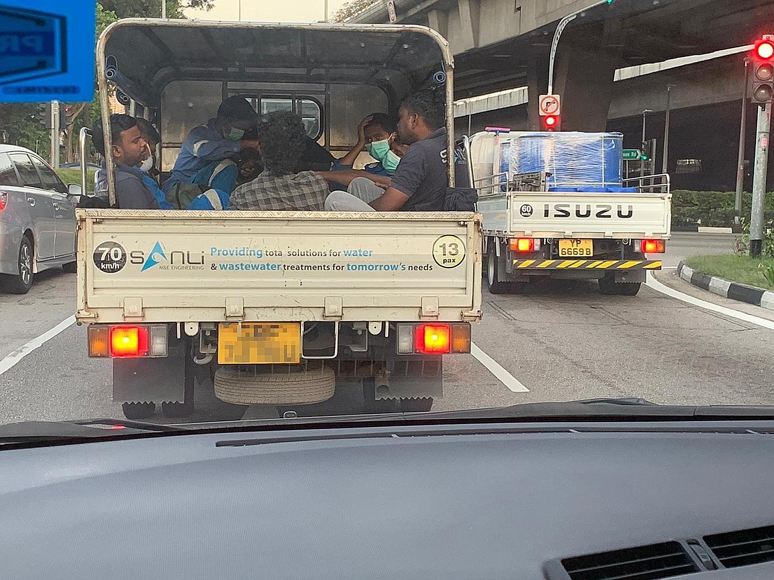 Workers crowded into the back of a lorry. In a joint advisory, the Manpower Ministry and Land Transport Authority said employers and lorry owners must ensure workers are able to maintain a safe distance of 1m.