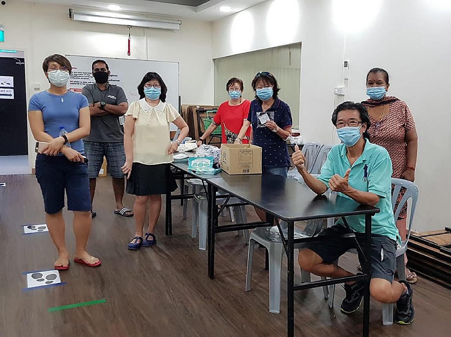 Mr Bernard Chiang (seated) with volunteers from the Braddell Heights Zone B Residents' Committee and Inter-Racial and Religious Confidence Circle during the reusable mask distribution.