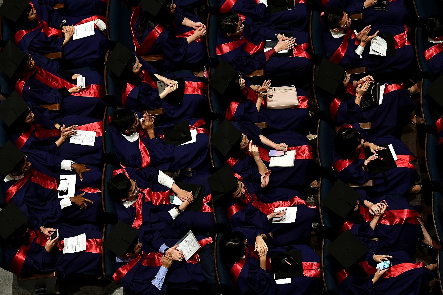 Above: About 7,000 students will be graduating from the National University of Singapore this year and 5,700 from Nanyang Technological University. Left: While job hunting, NTU final-year communications student Elizabeth Lee has decided to pick up ne