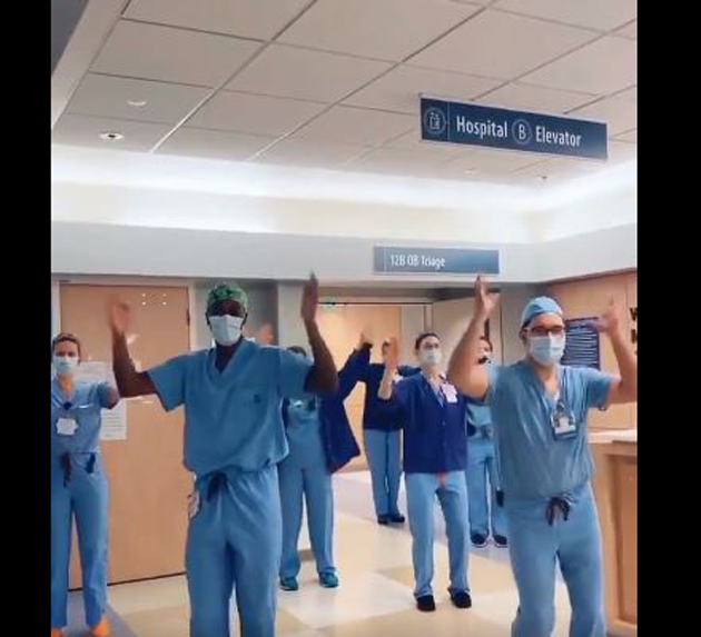 Dr Jason Campbell (front, at left) has taken the Internet by storm with clips featuring him and colleagues doing the ‘corona foot shake’, ‘the cha-cha slide’ and other dance moves.