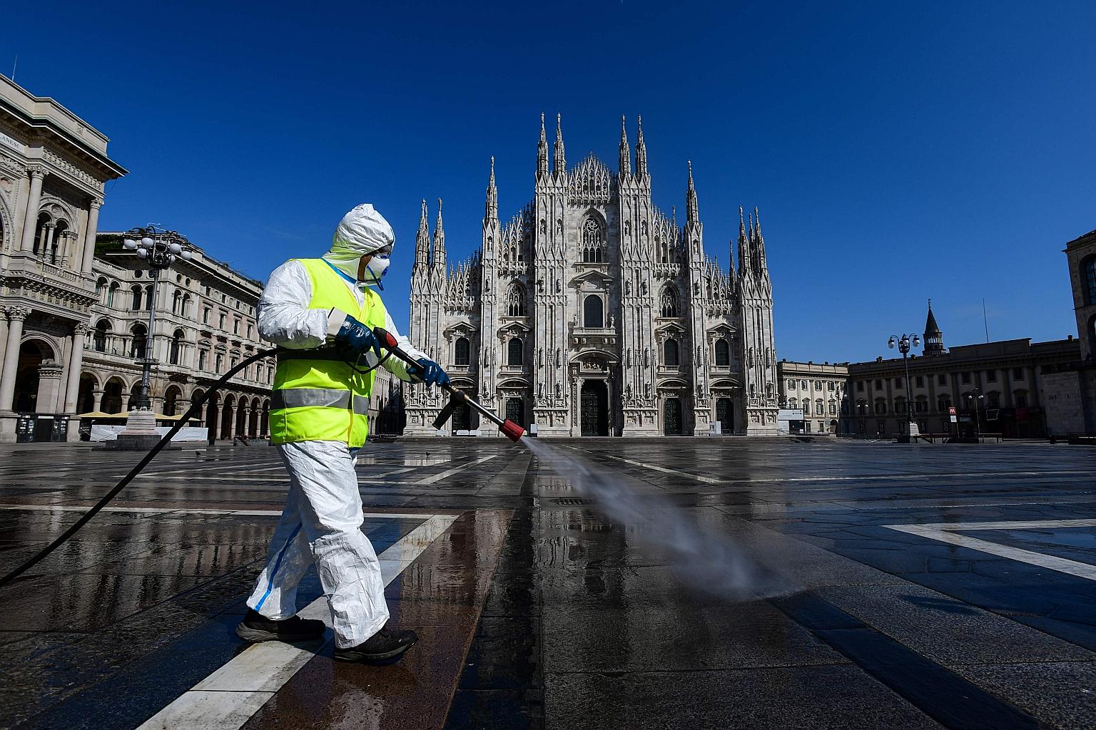 Milan's Piazza Duomo being disinfected on March 31. Italian Prime Minister Giuseppe Conte is seeking a tentative restart to commercial and public life after the lockdown ends on May 3.