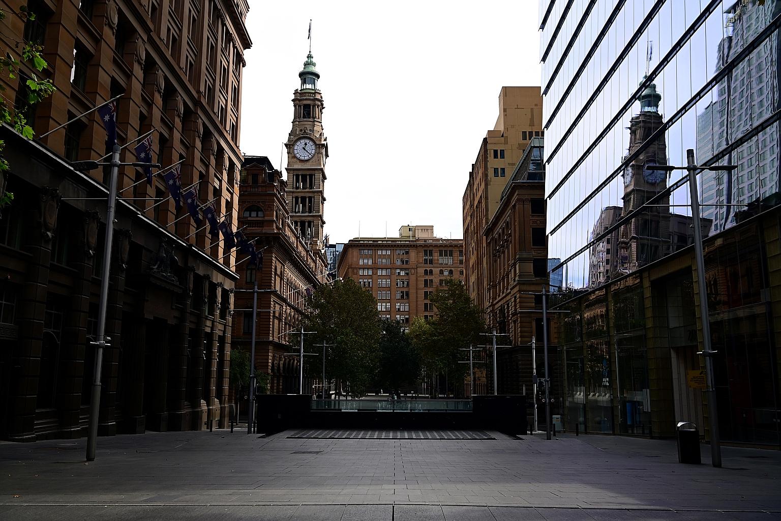 An empty walkway through the normally bustling Martin Place in Sydney, Australia. The coronavirus outbreak has led to the country's political and ideological foes uniting in a concerted bid to save workers' jobs, among other things.