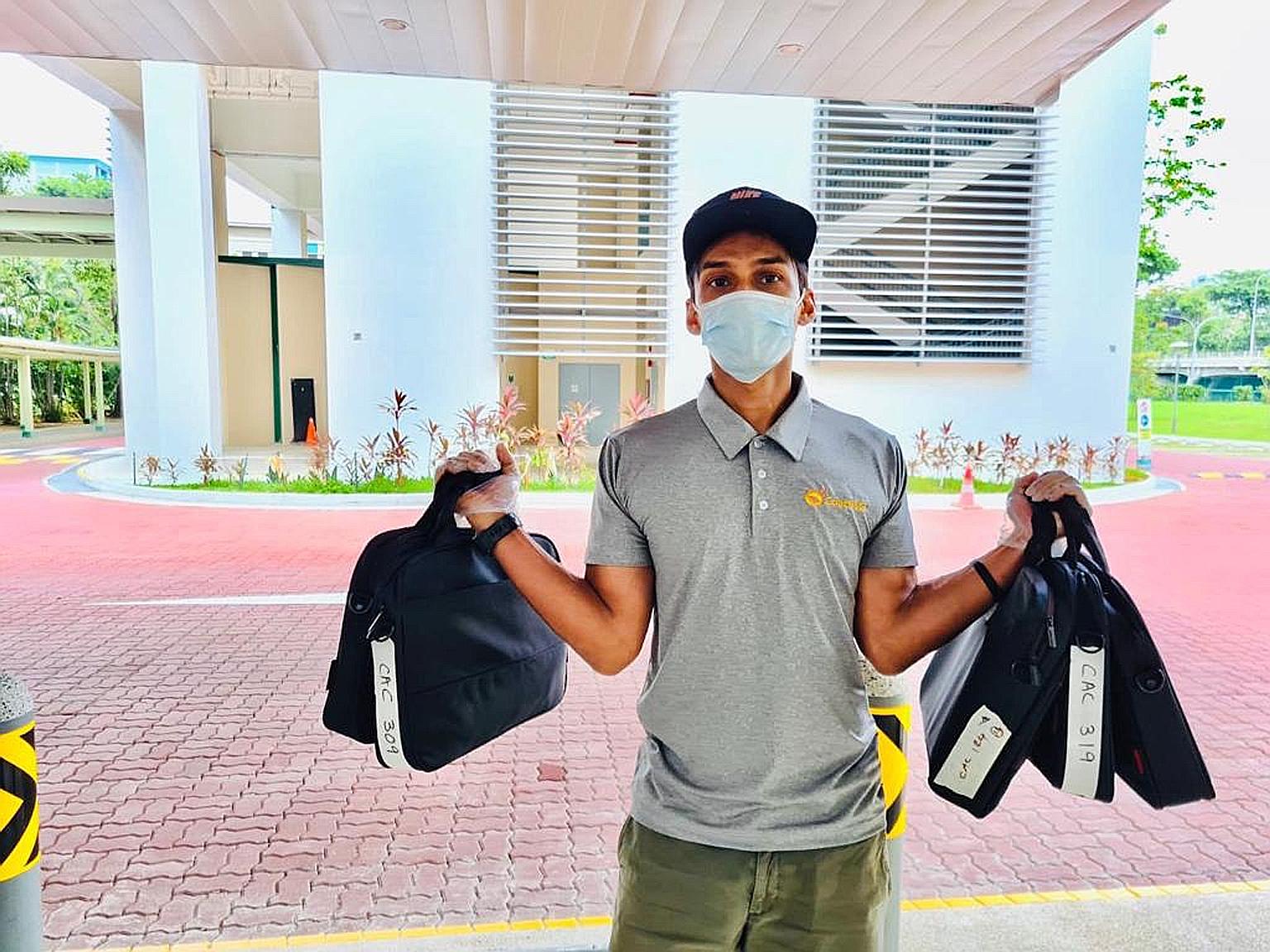 Former national sprinter U. K. Shyam delivering the first batch of laptops to a school on Monday. The 10 recipients also got a note handwritten by a national athlete and a video from Olympic gold medallist Joseph Schooling. PHOTO: TEAMSG
