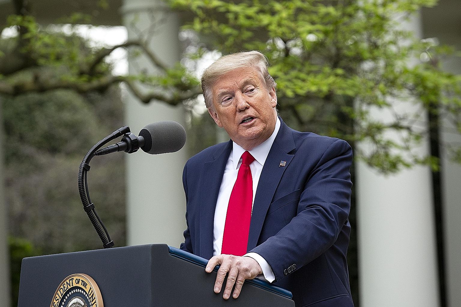 United States President Donald Trump speaking at a news conference at the White House in Washington on Tuesday. Experts have criticised his decision to suspend funding to the World Health Organisation, calling the move a scapegoating of the agency an