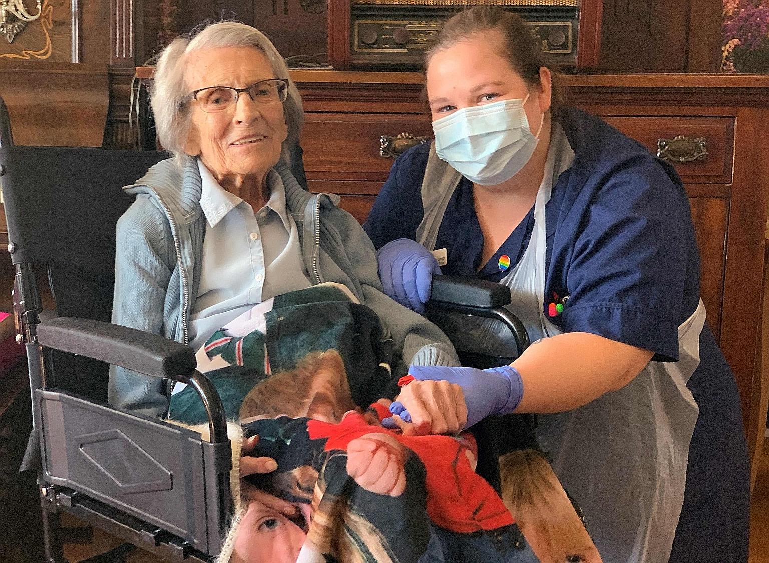 Ms Connie Titchen with nurse Kelly Smith in Birmingham, central England. PHOTO: AGENCE FRANCE-PRESSE