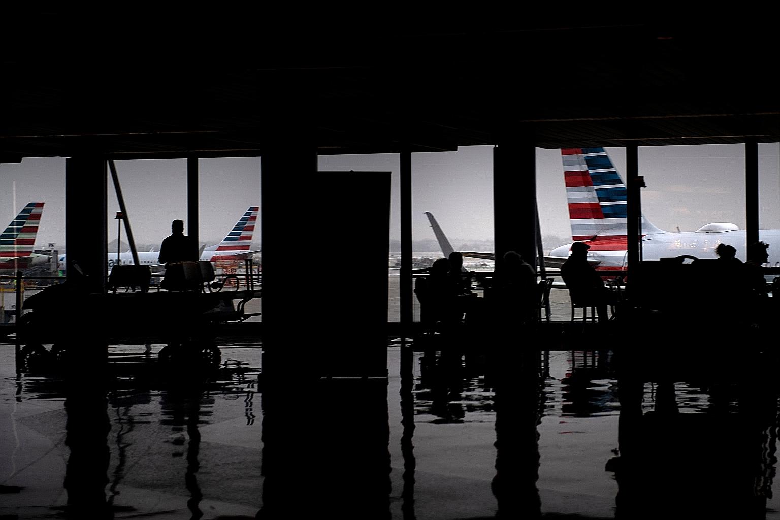 American Airlines planes, seen here at Chicago's O'Hare International Airport in January. Figures from Skytra, an airline hedging business, show a slump in the United States and Europe last month that is steeper and ongoing, as airlines slash fares o