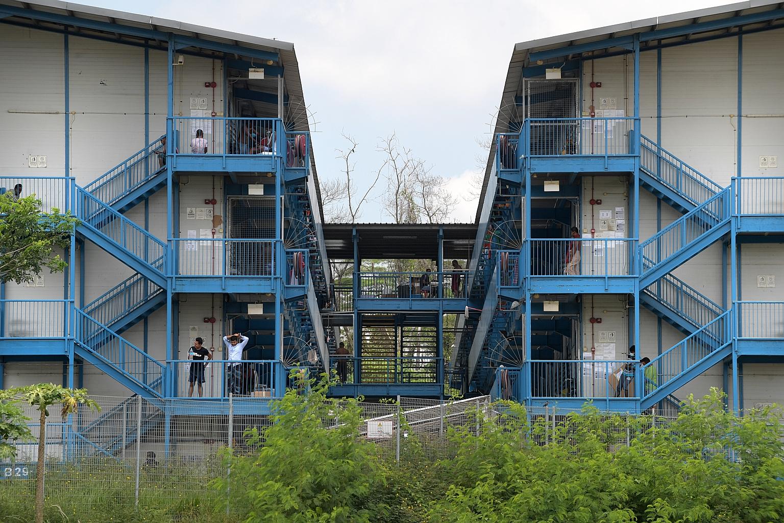 Left: The North Coast Lodge is one of 13 foreign worker dormitories that have been declared isolation areas. ST PHOTO: ALPHONSUS CHERN