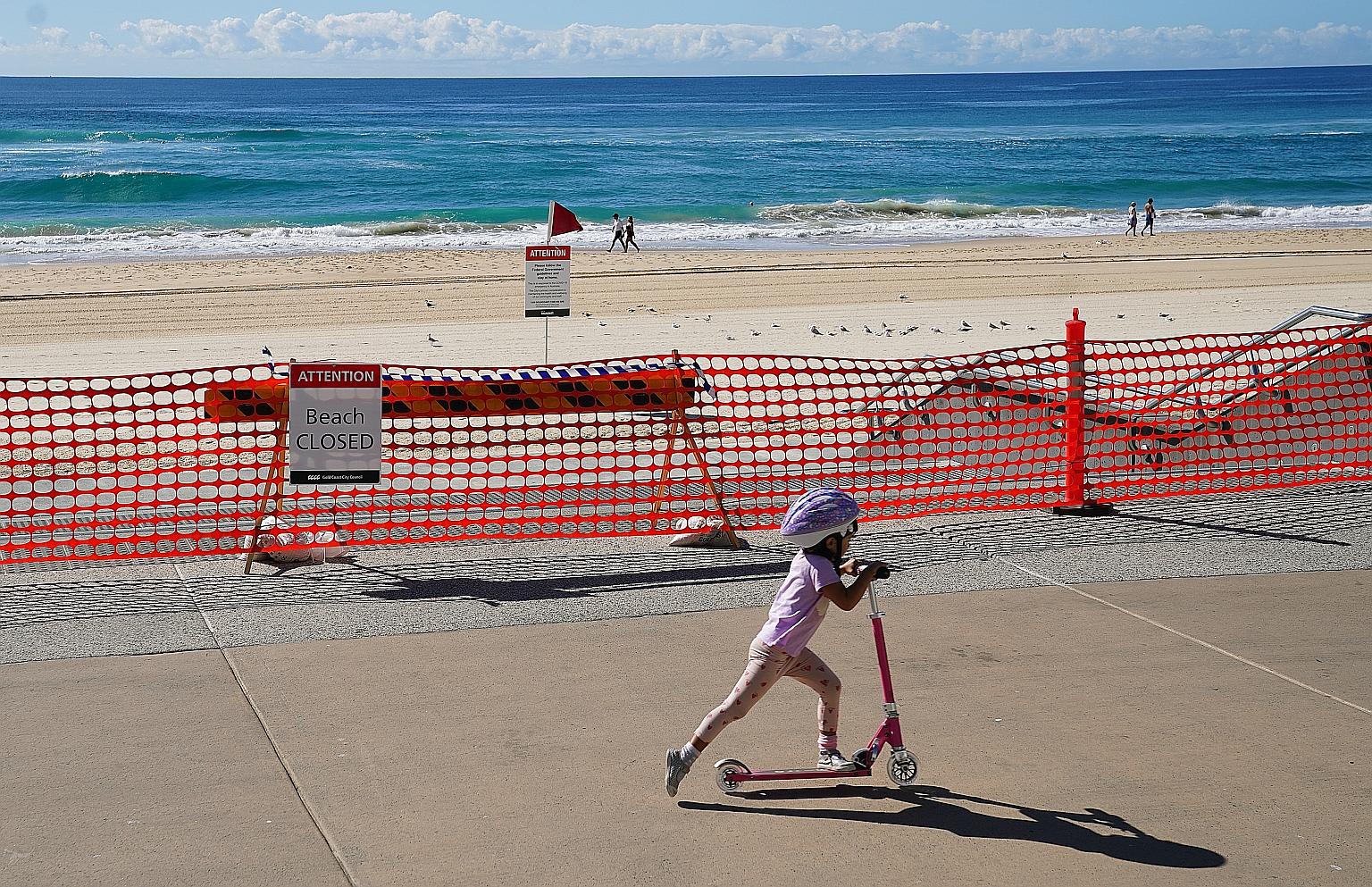 A closed section of Surfers Paradise Beach on Thursday in the Gold Coast, Australia. Some social distancing measures are likely to remain for several months, Australian Prime Minister Scott Morrison said yesterday. PHOTO: EPA-EFE