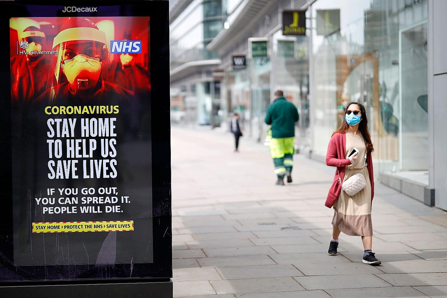 A sign at a bus stop in Victoria Street, in central London, reminding people of the importance of staying home to prevent transmission of the coronavirus. Britain has extended its lockdown by three weeks, and Foreign Minister Dominic Raab has warned 