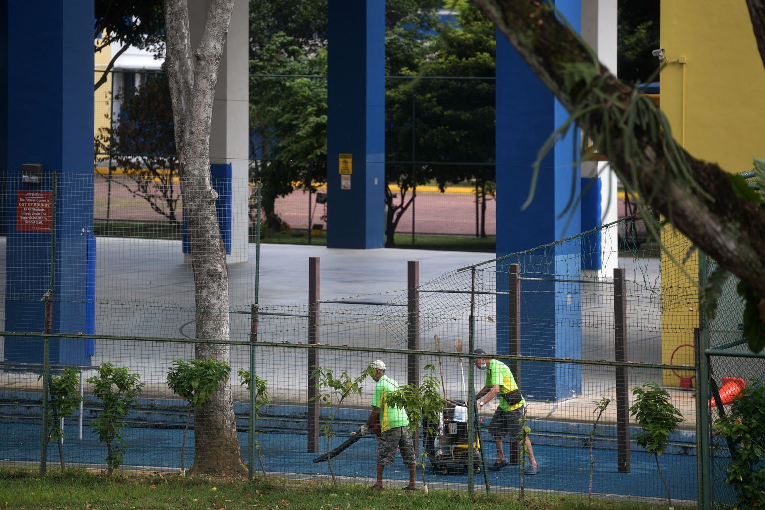 Cleaners at Beatty Secondary School last week, after schools shifted to full home-based learning. The advisory said cleaning firms should consider increasing the wages of cleaners with higher workloads or providing them with allowances.