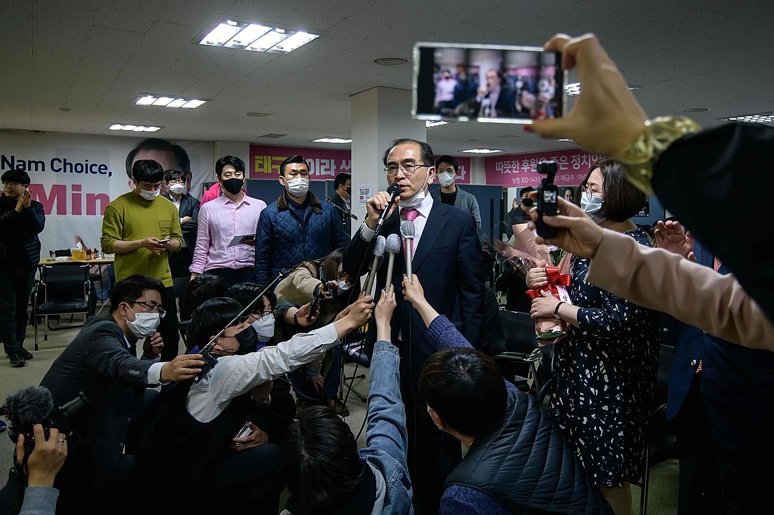 Mr Thae Yong Ho (above) speaking to the media after his victory in South Korea's polls. Netizens have mocked the North Korean defector's victory, with memes like this one (left) saying: "Gangnam Stalin. A bright future for Gangnam. Who cares about No