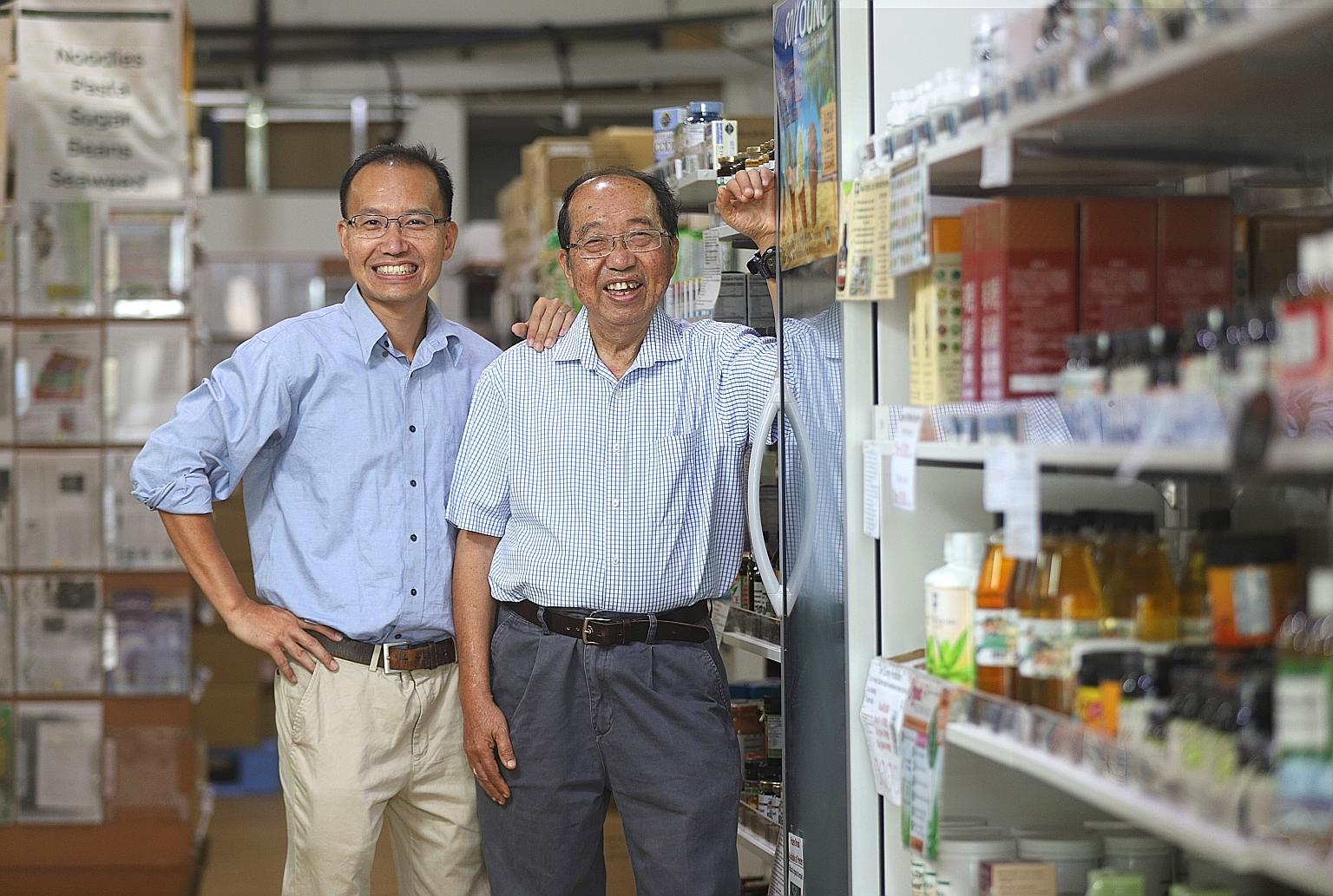 Nature's Glory founder Peter Lim, 77, with his son Christopher, 47, at their organic food shop in Tan Boon Liat Building. The firm plans to move into organic farming and start selling its products overseas. The elder Mr Lim quit his job as a business