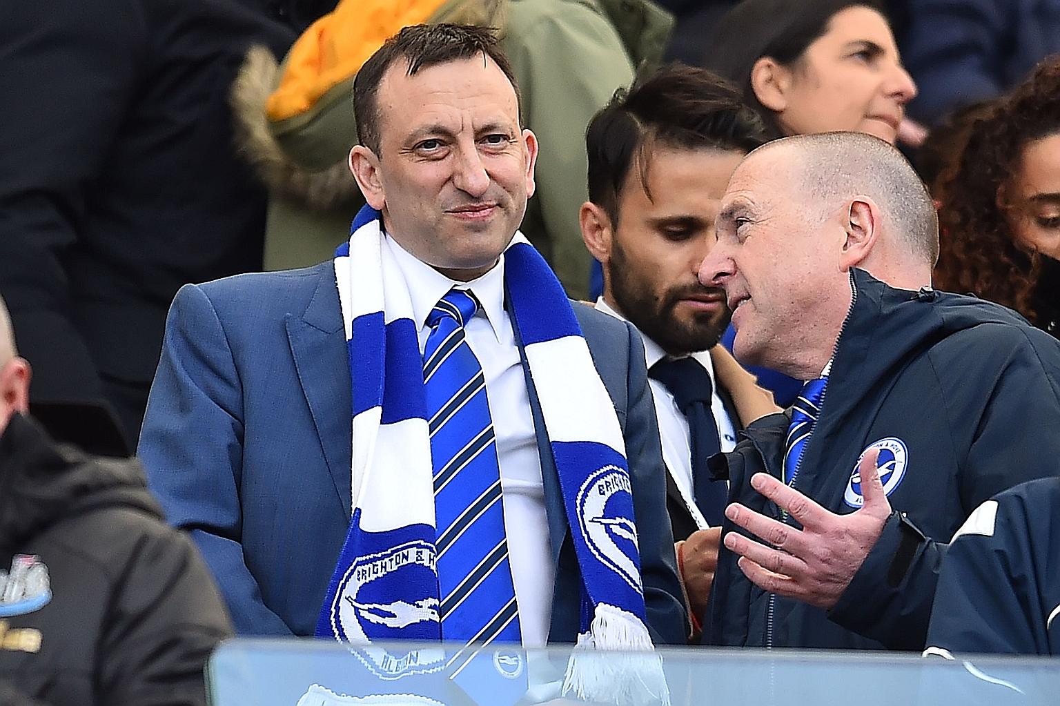 Brighton chairman Tony Bloom (striped scarf) says relegation should be scrapped if the Premier League cannot be finished.