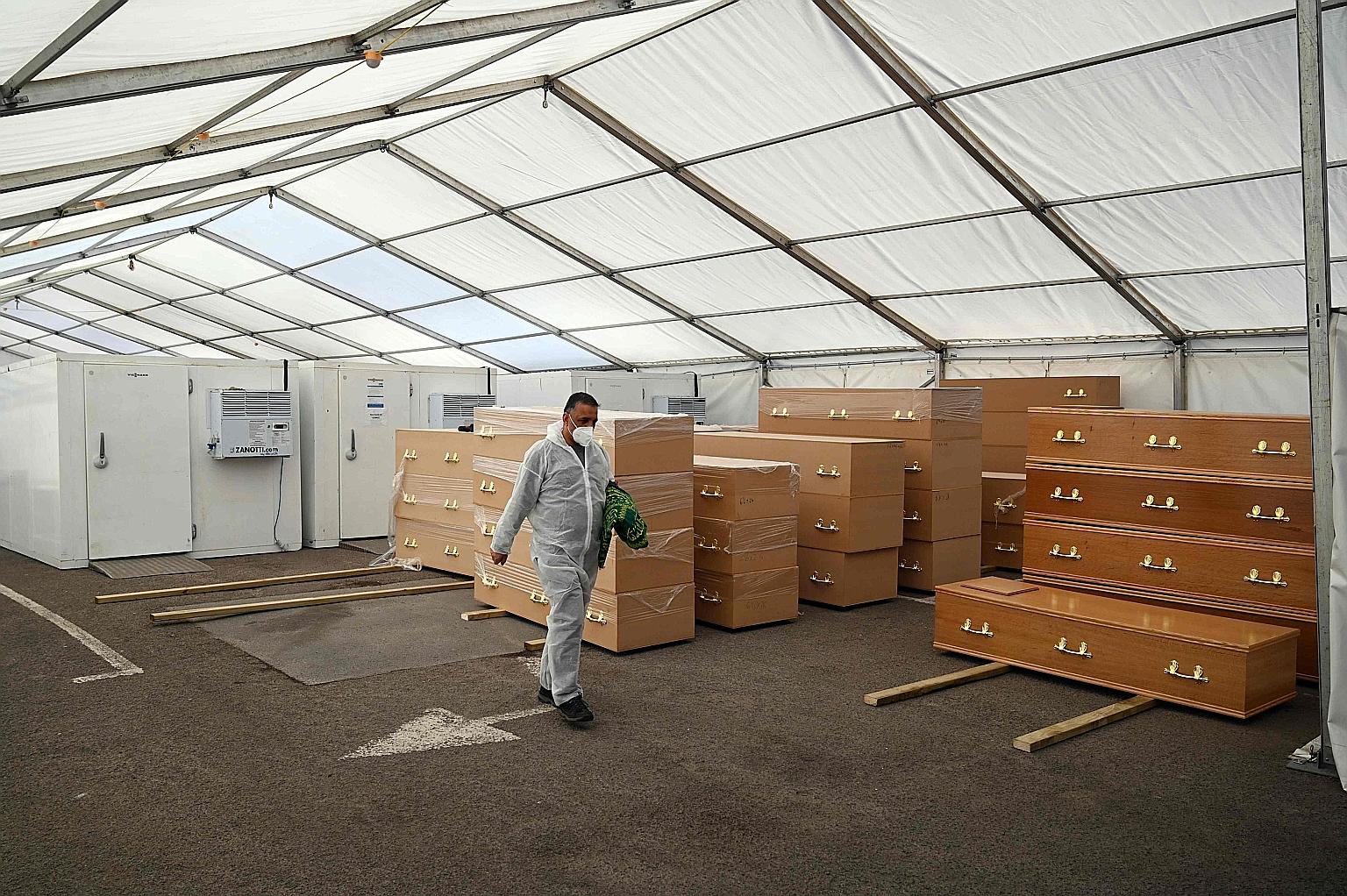 A temporary mortuary set up in a carpark in Birmingham, central England. With more than 16,000 deaths, the British government is under increasing pressure to explain elements of its response to the outbreak. PHOTO: AGENCE FRANCE-PRESSE