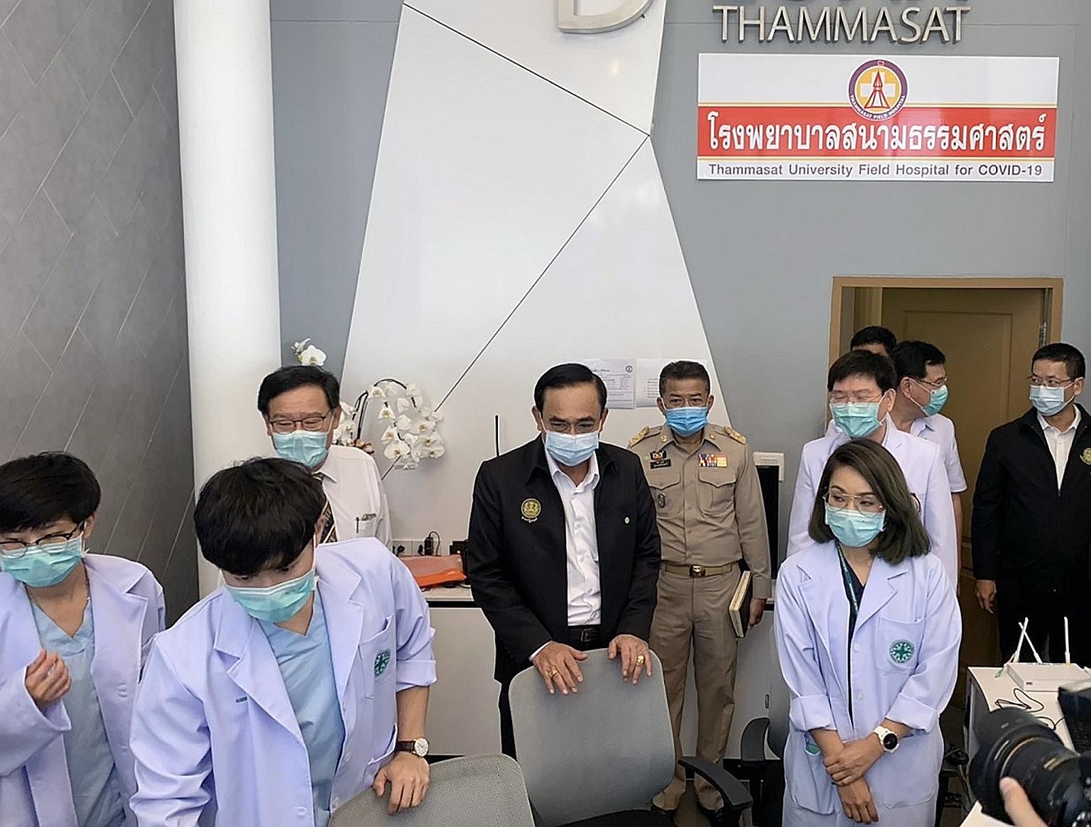 Thai Prime Minister Prayut Chan-o-cha (fourth from left) visiting the Thammasat University Field Hospital on Sunday. While Thailand is gaining control of the coronavirus situation, its economy could shrink 6.7 per cent this year.
