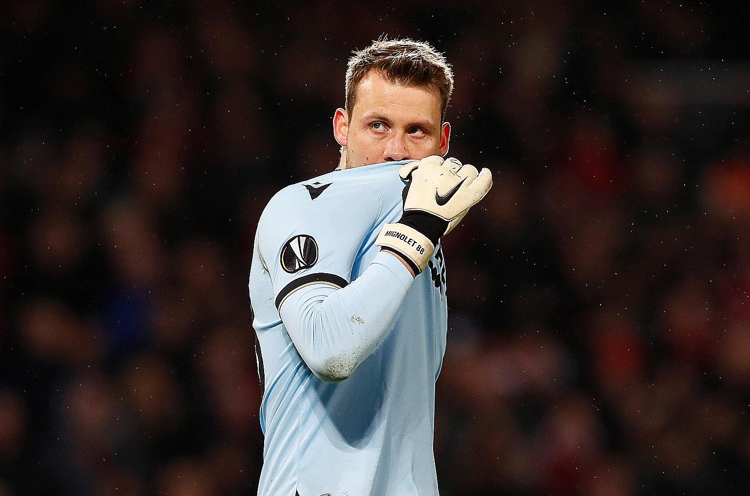 Club Brugge goalkeeper Simon Mignolet may have to wait for a while before celebrating his team's Belgian title win, after Uefa strongly recommended that European leagues complete their season. PHOTO: REUTERS