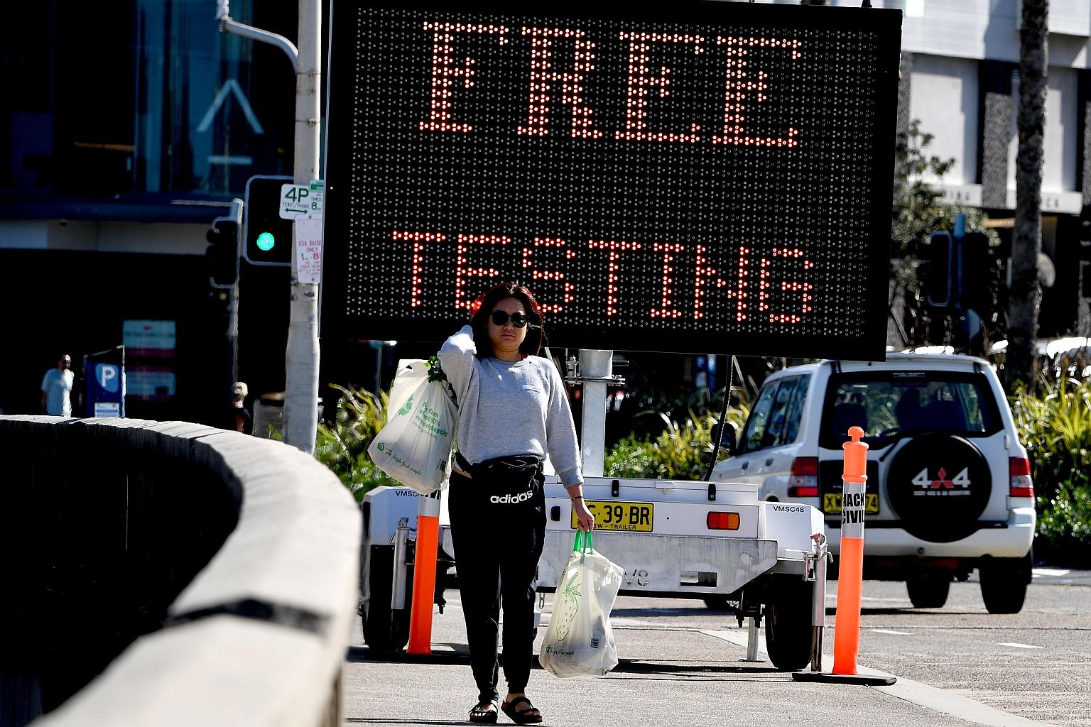 An advertisement for free Covid-19 testing being offered at Bondi Beach in Sydney yesterday. Infection rates have slowed in Australia, and local lawmakers plan to ease some curbs, with the iconic Bondi Beach set to partially reopen next week. PHOTO: