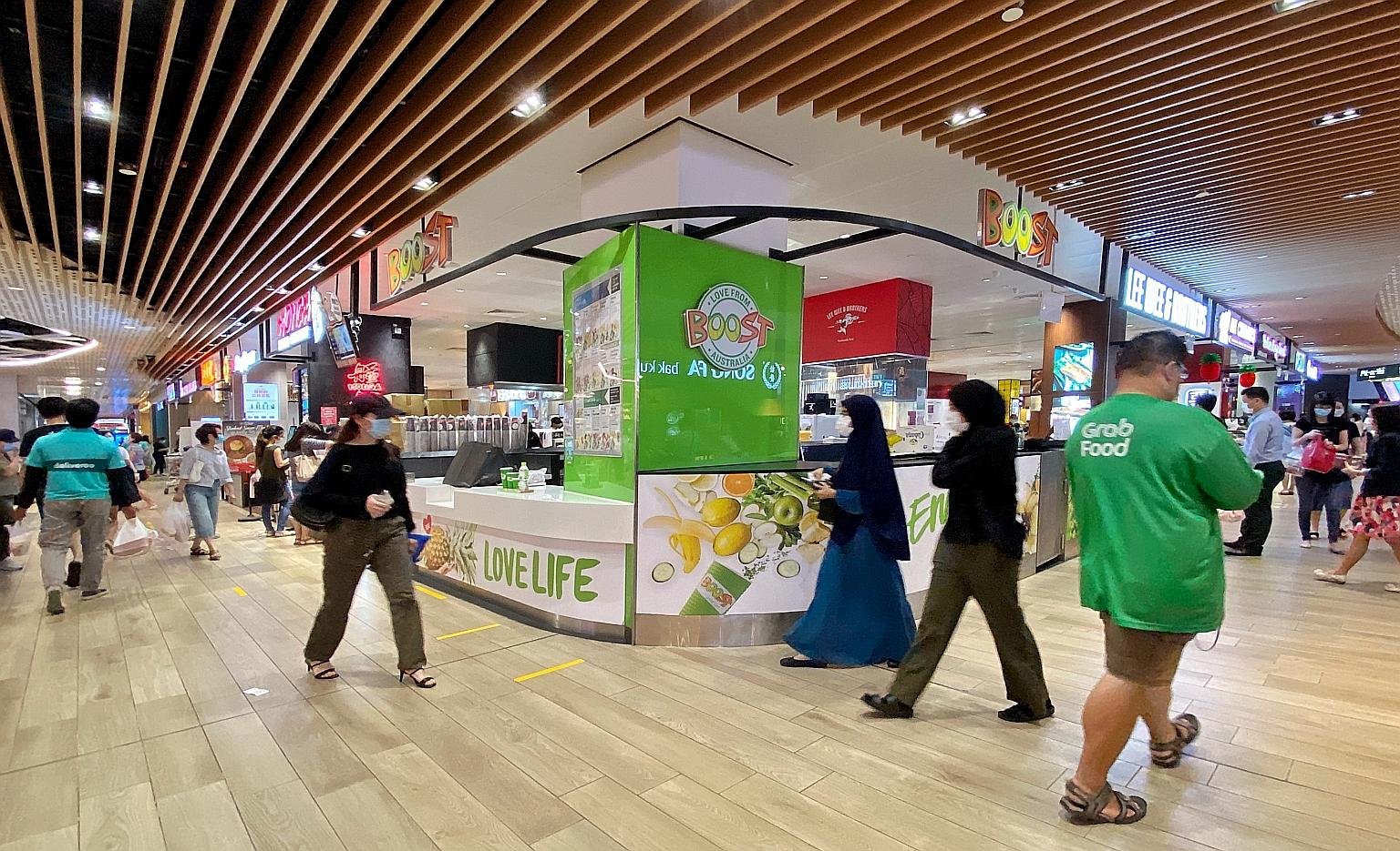 Jem shopping mall, where the Boost fruit juice outlet was closed yesterday. The list of services considered essential and allowed to open was trimmed to exclude some F&B outlets as well as barbers and other businesses, effective yesterday.