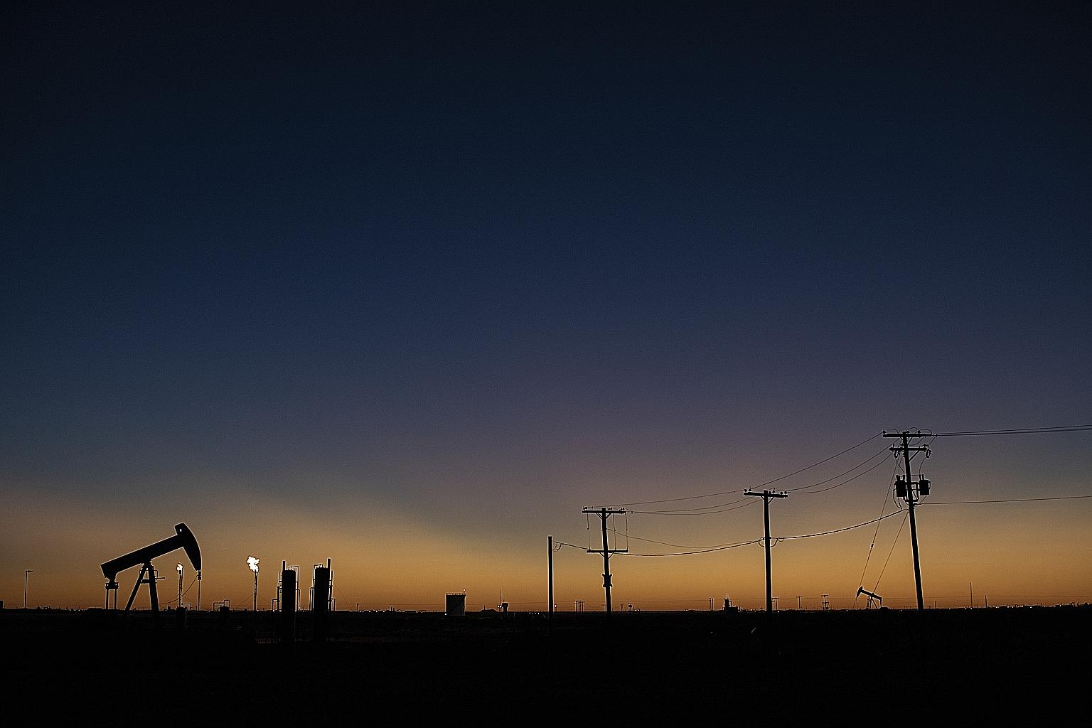 Pump jacks outside of Midland, Texas, in January last year. With global storage space filling up fast and oil demand slumping by around 30 per cent, production shut-ins are so far proving too little to rebalance the market. PHOTO: NYTIMES