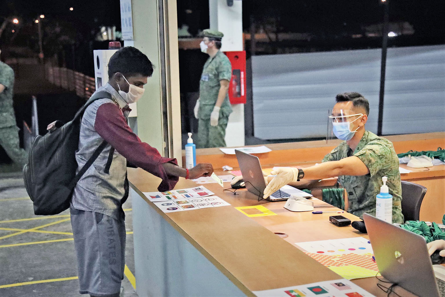 Sarimbun Scout Camp in Lim Chu Kang, one of the premises being used to house foreign workers. Marquees at Tanjong Pagar Terminal on Wednesday. A large facility is being set up that could house up to 15,000 Covid-19 patients or foreign workers, as the