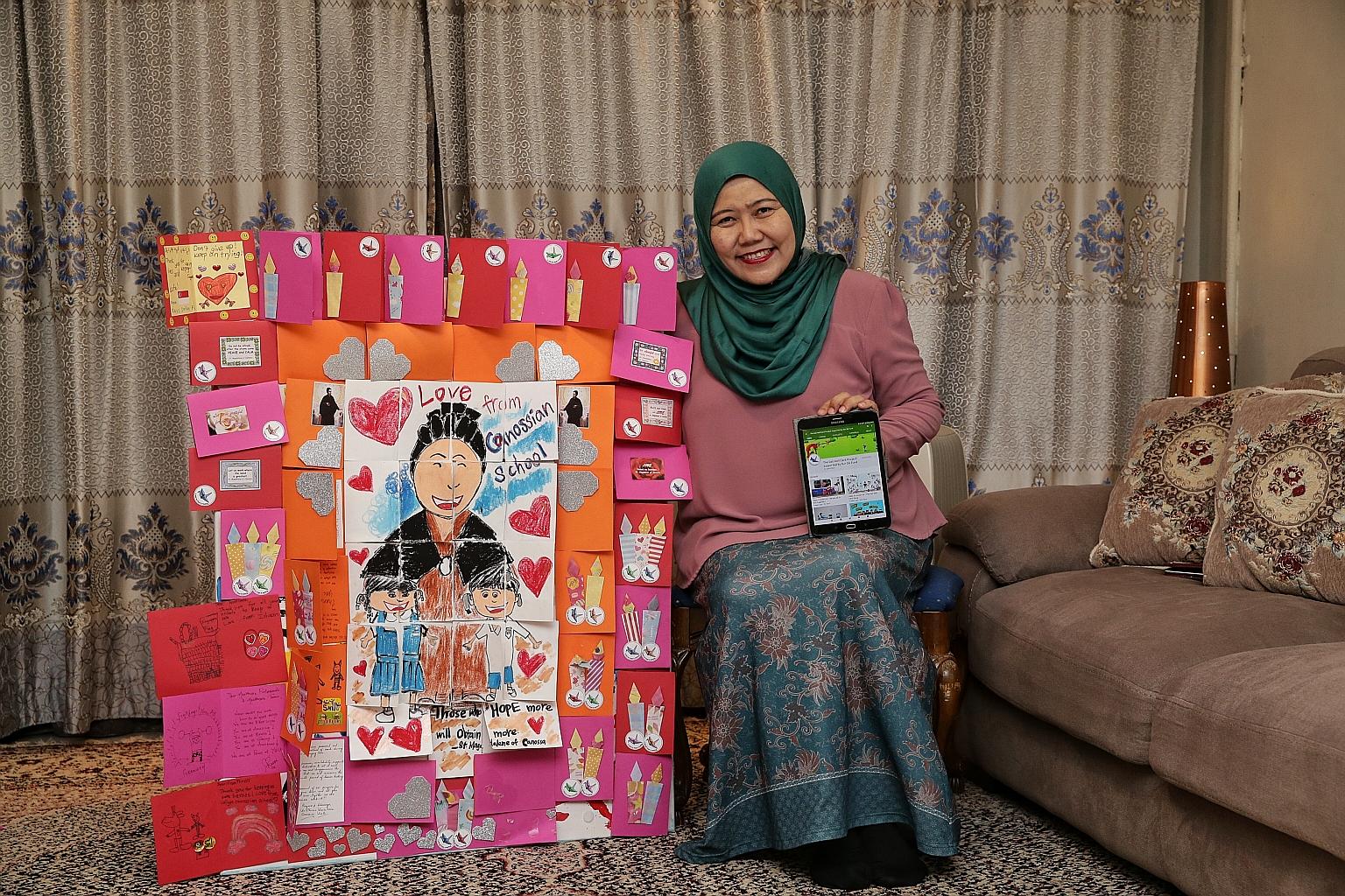 Madam Rahimah A. Rahim with a montage of cards from children and The Get Well Card Project video series on her tablet.