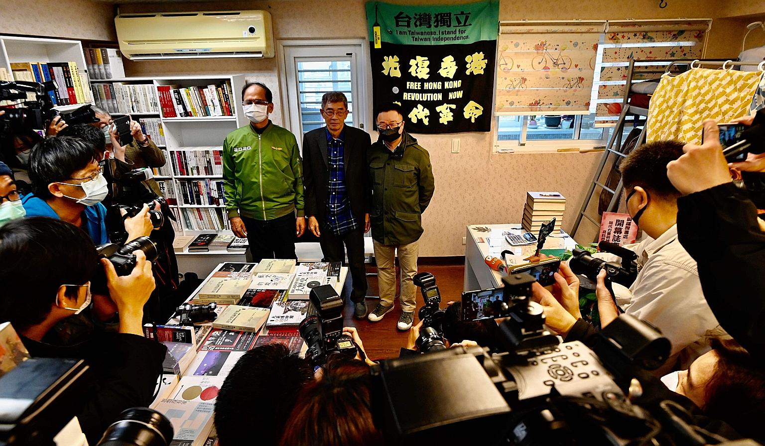 Mr Lam Wing Kee, a dissident bookseller from Hong Kong, being flanked by well-wishers, Taiwan parliamentary Speaker Yu Shyi-kun (left) and Mr Luo Wen-jia, secretary-general of the ruling Democratic Progressive Party, at the launch of Causeway Bay Boo